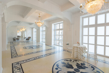 beautiful stylish chic rich clean bright blank interior. high white walls with large windows from floor the pattern on the floor