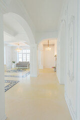 beautiful stylish chic rich clean bright blank interior. high white walls with large windows from floor the pattern on the floor