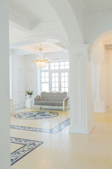beautiful stylish chic rich clean bright blank interior. high white walls with large windows from floor the pattern on the floor