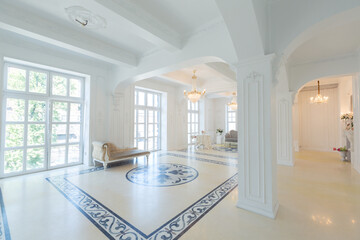 beautiful stylish chic rich clean bright blank interior. high white walls with large windows from floor the pattern on the floor