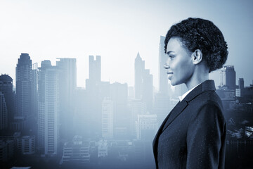 Successful smiling black African American business woman in suit. Bangkok cityscape. The concept of...