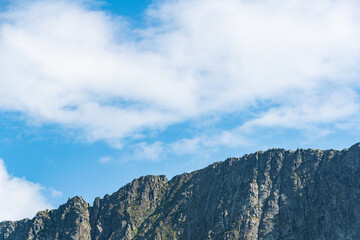 Blue sky and clouds over the rocks, beautiful cloud landscape over mountain range