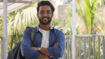 Man Standing and folding his hand smiling