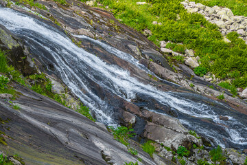 Beautiful river with crystal clear water among fall forest