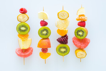 Full of vitamins, juicy fruit skewers The concept of healthy eating and diet, White background