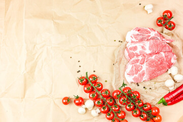 composition of meat tenderloin, cherry tomatoes, mushrooms on a light beige background