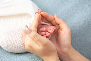 Newborn baby feet. Motherhood concept. Mother day. Copy space. Newborn baby feet. Motherhood concept. Mother day. Copy space. Selective focus