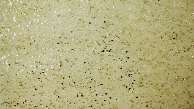 Shiny golden champagne christmas background with bright rhinestones