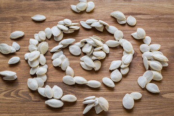 pumpkin seeds on a wooden table