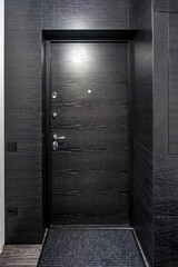 black wooden door in dark style color for modern interior and apartments flat or office