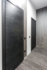 black wooden door in dark style color for modern interior and apartments flat or office