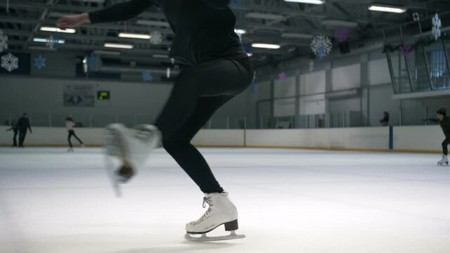 Beautiful dance of a young figure skater on ice