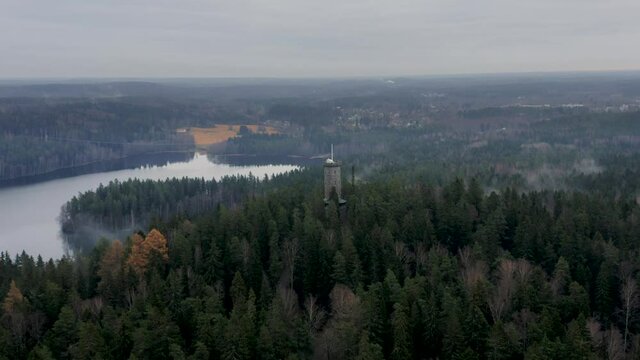 Aerial view of Aulanko tower in the city of H&auml;meenlinna. On the background you can see national landscape of Finland.