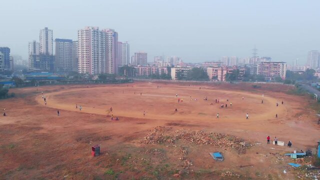 Mira road playground under construction city line cityscape buildings and mountains drone shot bird's eye view