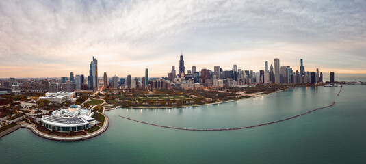 Wide angle Chicago city skyline aerial panorama with Lake Michigan in the foreground overlooking...