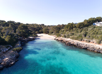 Drone picture of a wonderful beach with blue water and white sand in Majorca, Spain.