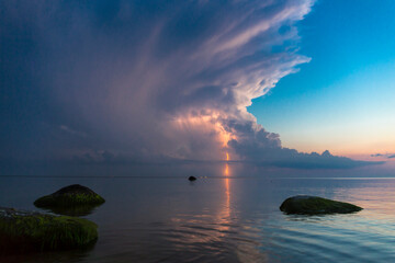 Beautiful scene with stormfront and lightning summer seascape.