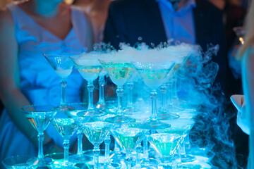 Pyramid of glasses of champagne. Drinks at the party.