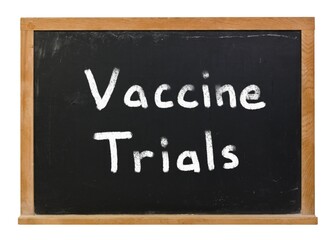 Vaccine Trials written in white chalk on a black chalkboard isolated on white