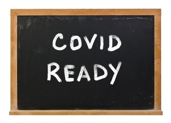 Obraz premium Covid Ready written in white chalk on a black chalkboard isolated on white