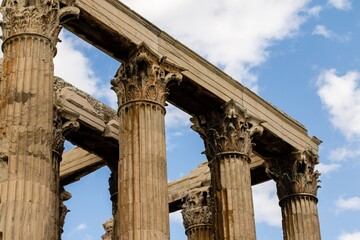 Fototapeta premium Beautiful ancient marble columns in Acropolis temple, Athens, Greece, blue sky