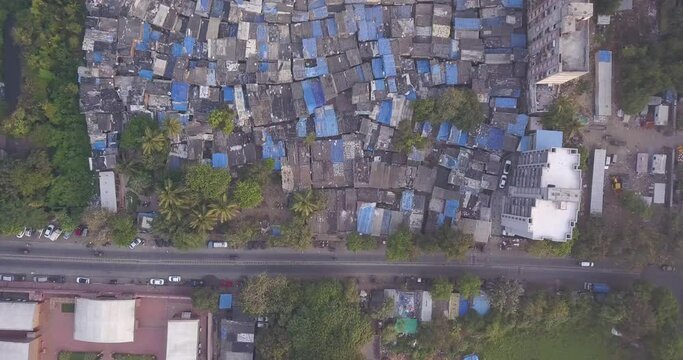 Slum Housing In Mumbai - Informal Settlements Along Urban Street In India. - aerial ascend