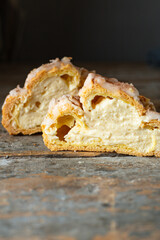choux pastry eclair shu profiterole the filling is sweet or savory fluffy dough homemade cake for the holiday ready to eat on the table meal snack top view copy space for text food background rustic
