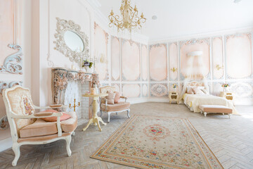 Luxurious expensive interior design of the children's room in the old Baroque style in beige colors