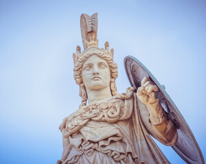 Athena the ancient Greek goddess statue under dramatic sky, Athens Greece