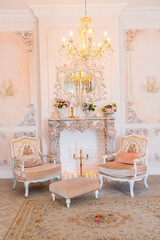 Luxurious expensive interior design of the children's room in the old Baroque style in beige colors