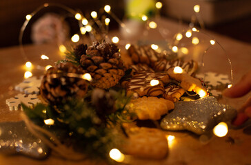Cookies and pine cones with golden light bokeh, Christmas concept and happy new year.
