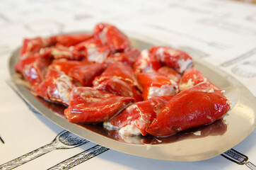 Delicious homemade stuffed peppers. Red peppers stuffed with mayonnaise and cod.