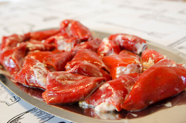 Delicious homemade stuffed peppers. Red peppers stuffed with mayonnaise and cod.