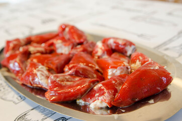 Delicious homemade stuffed peppers. Red peppers stuffed with mayonnaise and cod.