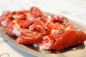 Delicious homemade stuffed peppers. Red peppers stuffed with mayonnaise and cod.