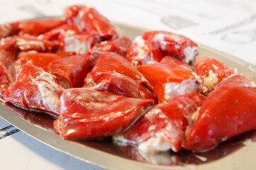 Delicious homemade stuffed peppers. Red peppers stuffed with mayonnaise and cod.