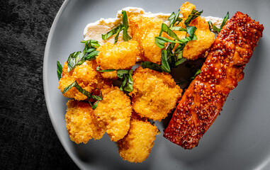 Salmon steak fillet with breading broccoli on plate