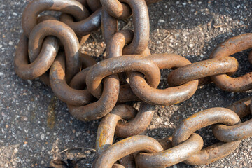 Close-up of bollards and iron chains on an old River barge. Securing the ship with a large chain....