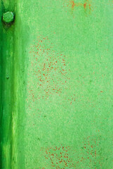 rust spots on the paint on a green background