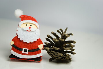Santa Claus - Christmas decoration with santa and star. Small decorative accessories. Christmas decorations. Glitter star and santa claus on neutral backgrounds.