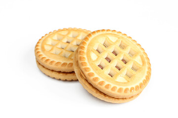Two chocolate filled cookies isolated on white background. Tea biscuits