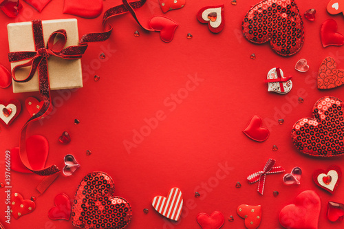 Valentine's day or Wedding romantic concept with Red hearts on red background. Top view, copy space.