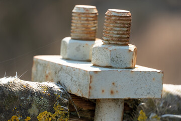 Cables and ropes of the suspension bridge close-up. Repair of the old bridge over the river. Rusty...