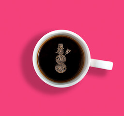 Creative concept with cup of coffee and snowman made of coffee foam. Flat lay design
