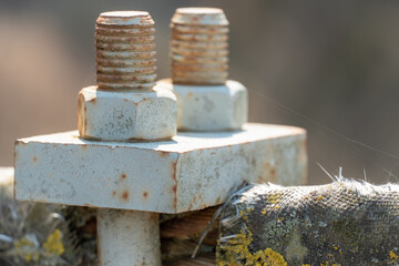 Cables and ropes of the suspension bridge close-up. Repair of the old bridge over the river. Rusty...