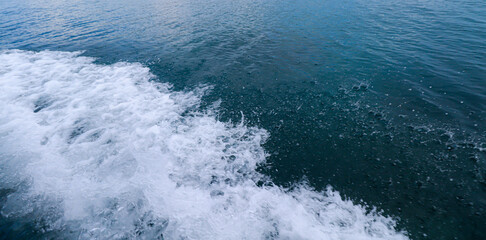 waves and foam on the blue sea