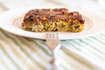Zucchini pie on a white plate