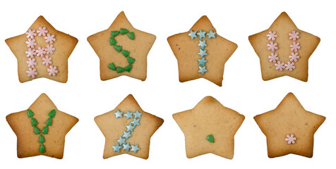 Set of letters of the alphabet in Christmas style from homemade gingerbread. Decorated cookies for New Years celebration.