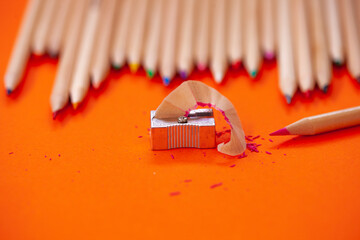 colored pencils and pencil sharpener copy space