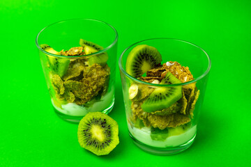 Healthy breakfast. Cereal and yogurt. Close-up on a green background.